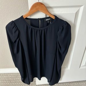 Navy DKNY blouse worn once size Med. Washable. Pretty pleats, shoulder detail